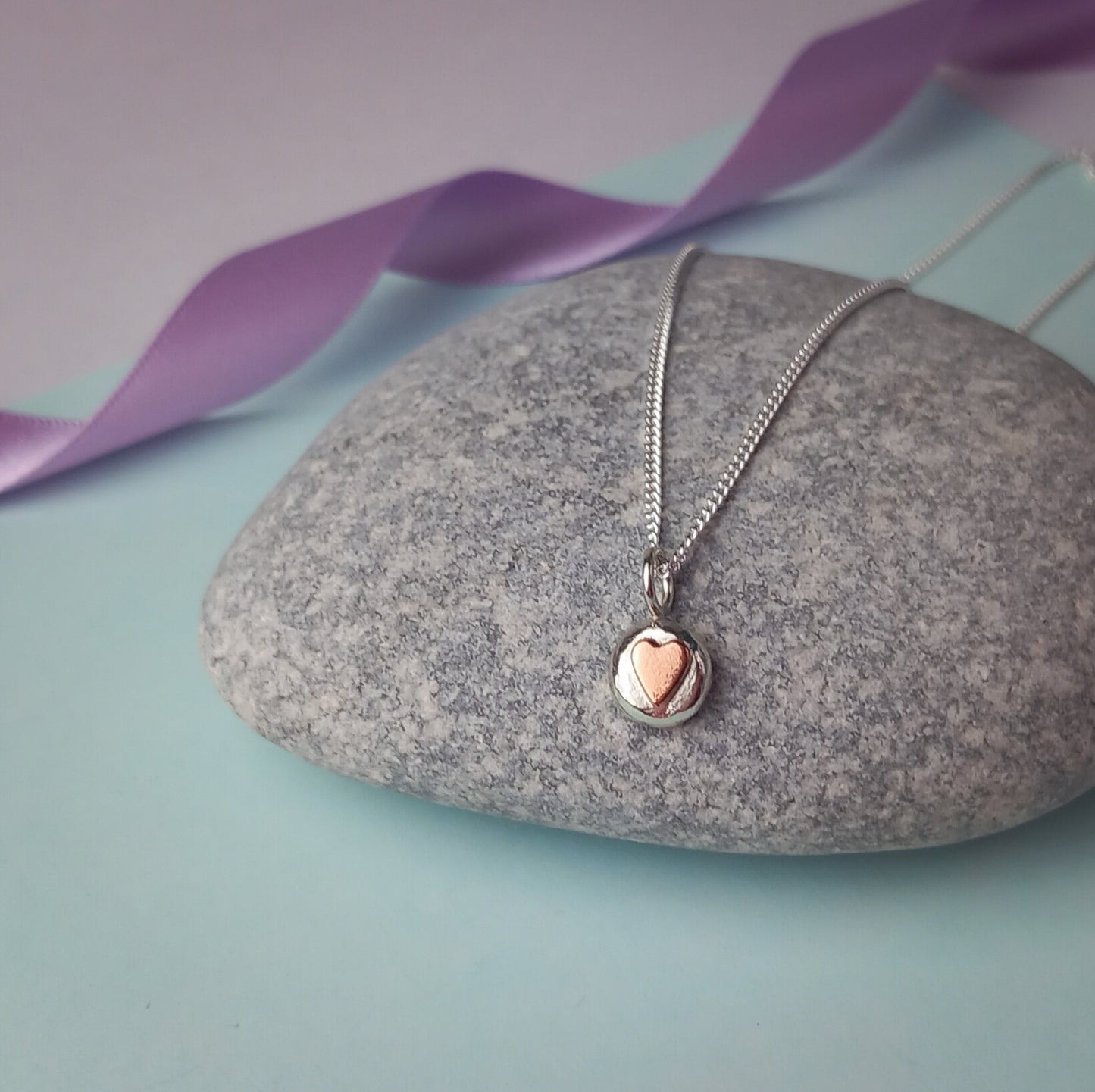 Solid Silver Pebble pendant with Copper Heart.