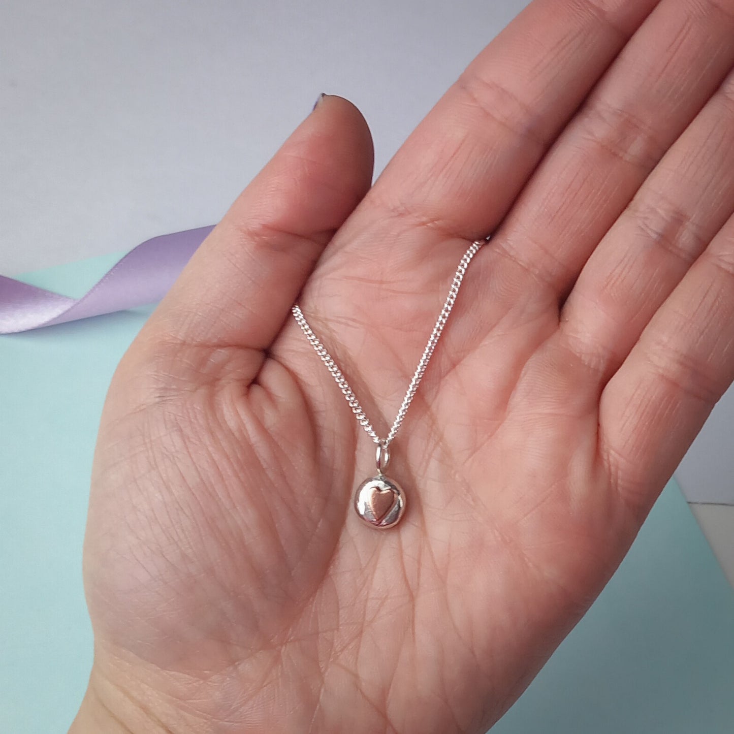 Solid Silver Pebble pendant with Copper Heart.